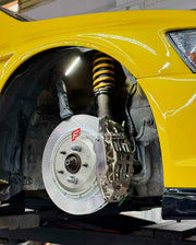 ADTORY X FORZA PERFORMANCE RACE BIG BRAKE KIT BBK for MITSUBISHI LANCER EVOLUTION VII VIII IX CT 2001 - 2007
ADTORY Brake Kits are engineered as bolt on upgrades that work with the factory master cylinder and ABS, delivering stronger, more repeatable stops with the pedal feel you want. Whether you cruise the city, carve canyons, or chase lap times.
Highlights
Track-ready, heat-resistant components.
Jewel-like caliper finish is incredibly durable and easy to clean
Pistons are calibrated to integrate smoot