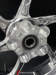 We manufacture premium quality forged motorcycle wheels rims for TRIUMPH in any design, size, color.
Wheel sizes (motorcycle spec):
Front: 3.5 x 17
Rear: 5.5 x 17
Weight:
Front: 3.95 kg (8.7 lbs)
Rear: 4.8 kg (10.58 lbs)
Finishing: Gloss Silver
Forza Performance Group engineers and manufactures each forged motorcycle wheel individually per order. This ensures precise fitment, uncompromised strength, and unique styling. Whether for racing, touring, or daily use — our wheels are built for both perfor