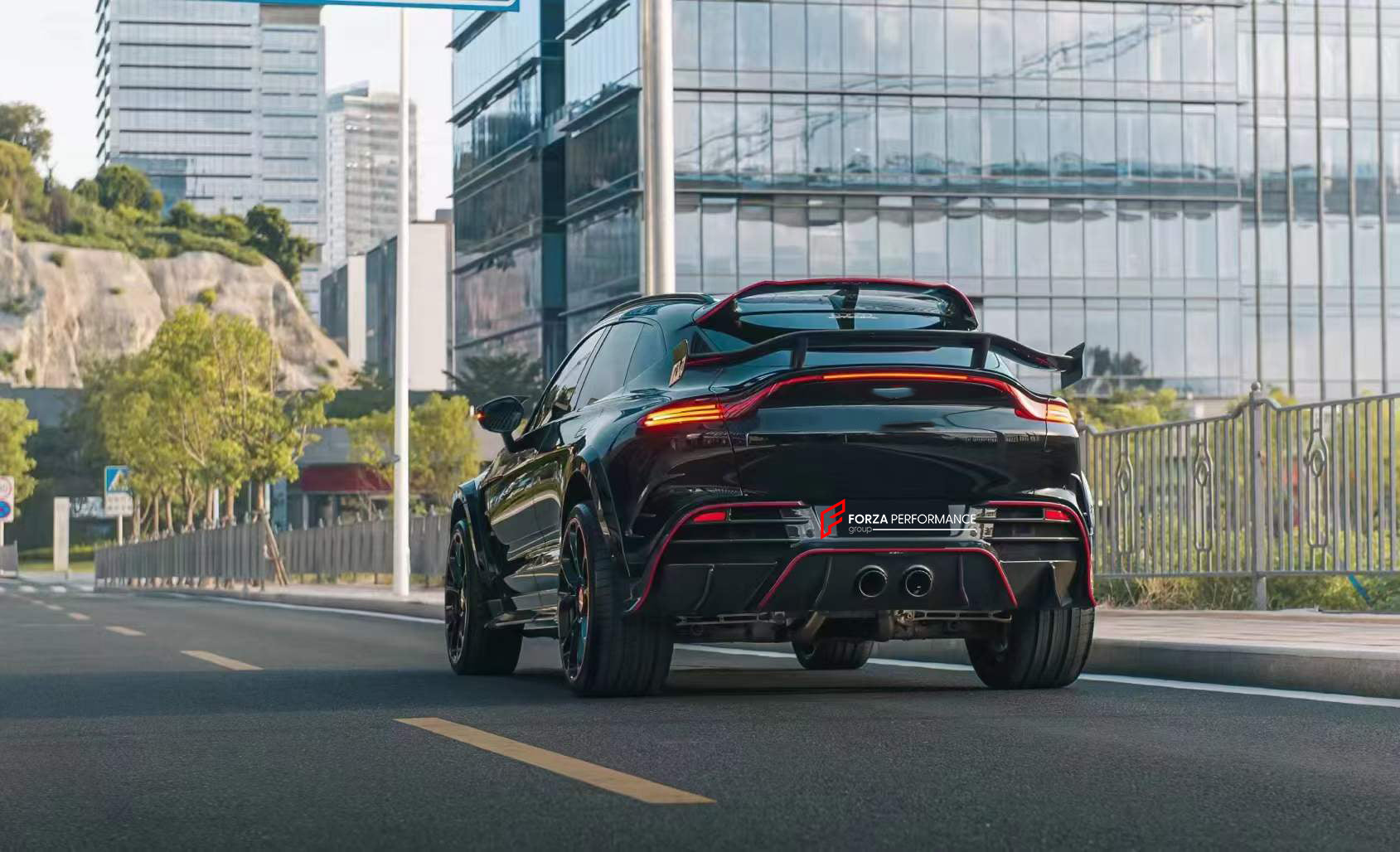 DRY CARBON BODY KIT for ASTON MARTIN DBX  Set includes:  Front Lip Side Fenders Hood Air Vents Side Air Vents Front Canards Side Skirts Rear Bumper Exhaust System Exhaust Tips