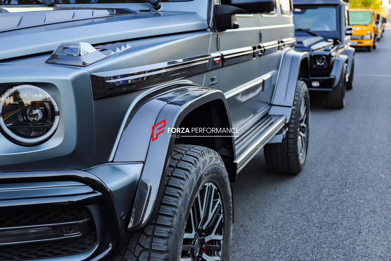 DRY CARBON BODY KIT for MERCEDES-BENZ W464 G63 4x4 G500 G550 2019 - 2022  Set includes:  Hood Front Grille Turn Signal Covers Side Fenders Side Trims Side Moldings Side Skirts Roof LED Bar Roof Rack Roof Ladder Spare Tire Holder Rear Bumper Reinforcement