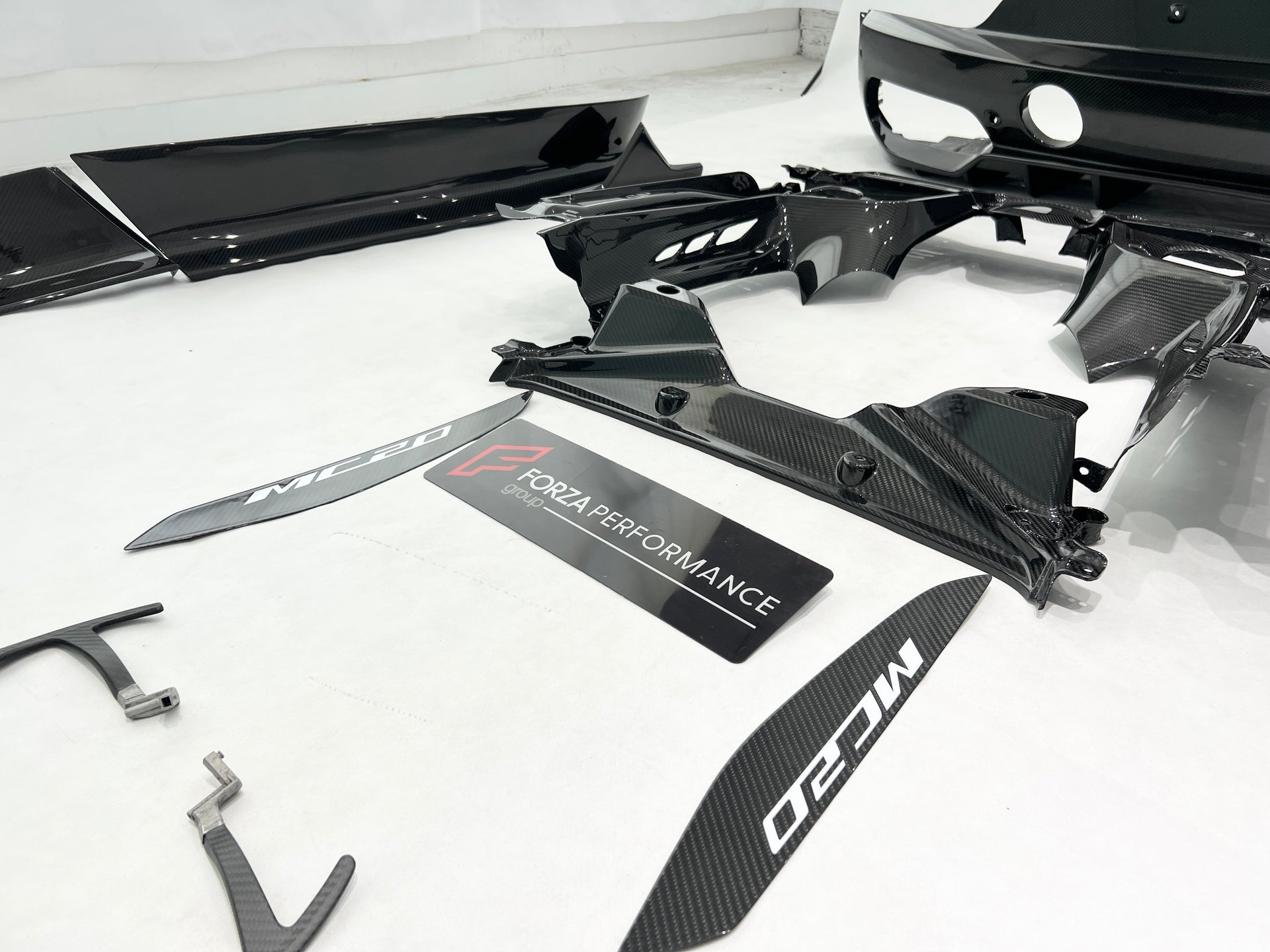 OEM STYLE DRY CARBON BODY KIT for MASERATI MC20 2020+  Set includes: Front Lip Side Skirts Rear Diffuser Rear Vent Trims Side Mirror Covers Shift Paddles Center Dashboard Cover Door Sills Engine Cover