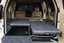 Deployable Slide Drawer Systems For Land Cruiser 200 LC200easily accessible storage space in your car. Designed solidly for tough for both on and off-road travel. Measurements: Fixed 1000*530*275mm / Roller 1000*530*275/150mm Which drawers are best for me? We have a turnkey solution and you are able to modify the whole drawers system with: - Sink faucet - Kitchen - Barrier - Slide floor - Table Board / Cutting board - Fridge