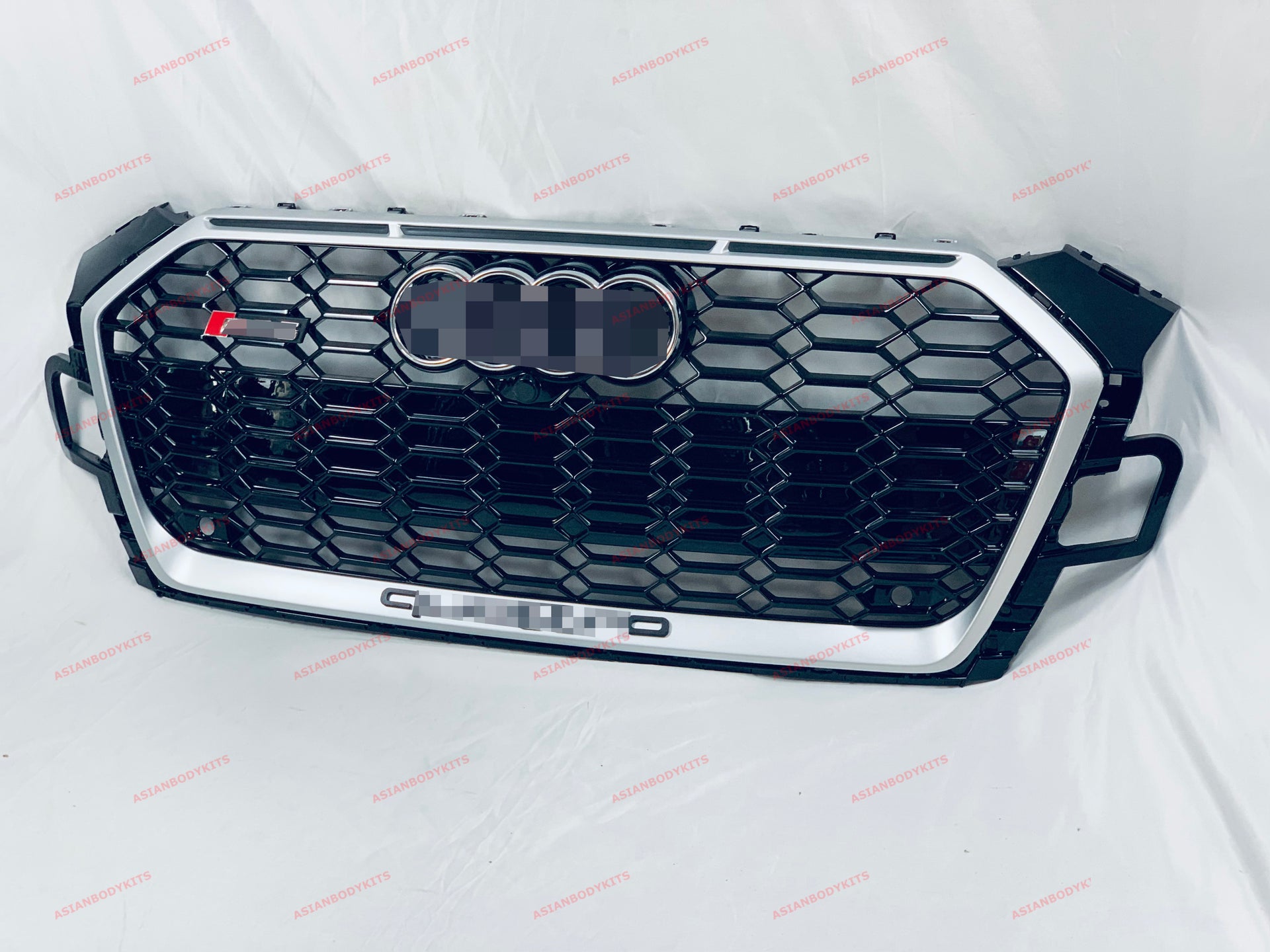 RS5 style FRONT GRILLE assembly for Audi A5 S5 F5 Coupe / Cabriolet / Sportback 2019+ Have PDC holes  License plate holder 1pc (for EURO or China regions) Include badges Include front camera housing with cap Color: Silver frame with black mesh  Material: ABS Plastic  Note: Professional installation is required, on some A5 models PDC sensors brackets can be in clash with hit bar, so you need to modify PDC sensors or hit bar  *If you have front camera, you need to remove it and GLUE to new RS grille