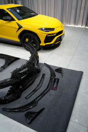 Forged Carbon Wide Body Kit For Lamborghini Urus 2017+
Set includes:
Front Bumper
Front Lip
Front Bumper Air Intakes
Front Bumper Air Intakes Lamels
Rear Bumper With Middle Exhaust
Rear Diffuser
Rear Bumper Air Outtake
Exhaust Tips
Hood/Bonnet
Air Outtake For Engine Hood/Bonnet
Front Fenders
Air Vent Tail Light
Mirror Covers
Race Flaps
Roof Spoiler
Trunk Spoiler
Rear Spoiler
Rear Decklid Spoiler
Engine Cover
Material: FULL FORGED CARBON
Note: Professional installation is required
CONTACT US FOR PRICING