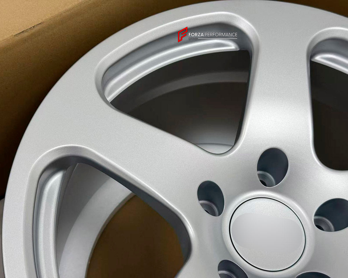 We manufacture premium quality forged wheels rims for Porsche 911 996 TURBO 1997 - 2006 in any design, size, color.

WHEEL SIZE:

Front: 18 x 8.0 ET 50
Rear: 18 x 11 ET 45
PCD: 5 x 130
CB: 71.6
Finish: Full Matte Silver
Material: 6061-T6 Forged Aluminum

THIS WHEEL DESIGN CAN BE CUSTOM-MADE FOR YOUR CAR IN ANY SIZE AND COLOR OPTIONS
Available in monoblock, 2-piece, 3-piece, duoblock, beadlock
3D wheel renderings are provided according to the exact dimensions and specifications requested by the client, ensur