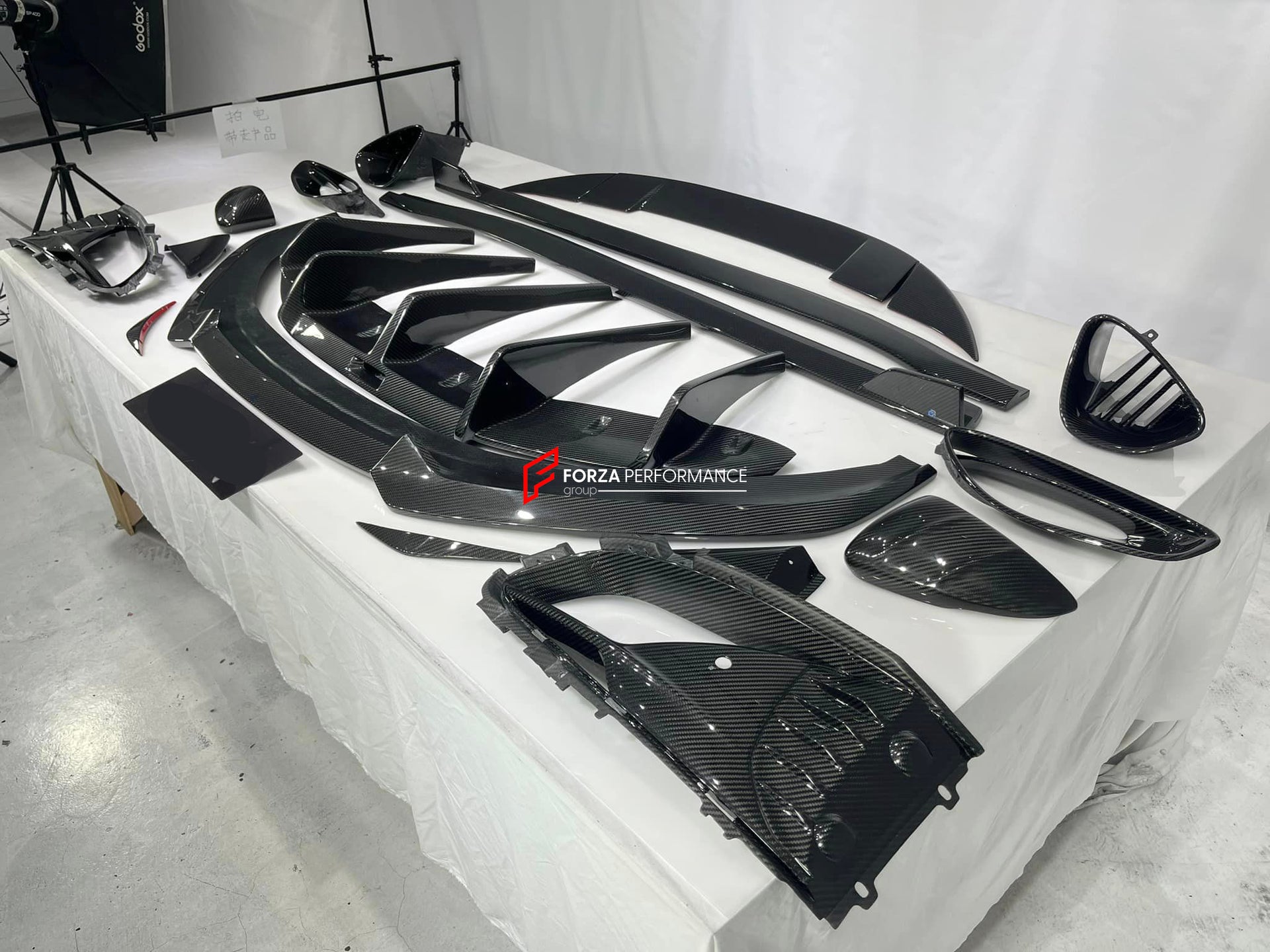DRY CARBON BODY KIT for LOTUS EMIRA  Set includes:  Front Lip Side Skirts Rear Diffuser Rear Spoiler Front Air Vents Side Air Vents Rear Air Duct Side Mirrors