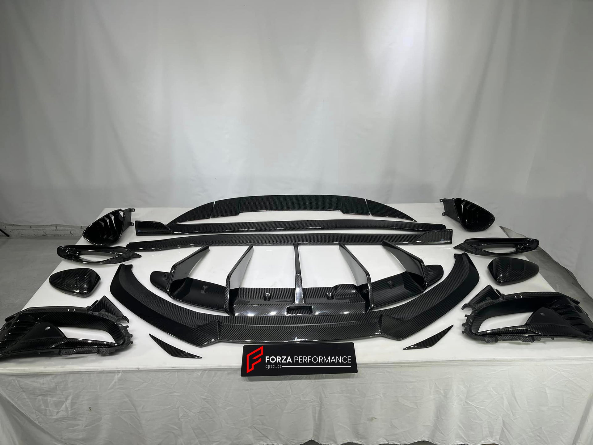 DRY CARBON BODY KIT for LOTUS EMIRA  Set includes:  Front Lip Side Skirts Rear Diffuser Rear Spoiler Front Air Vents Side Air Vents Rear Air Duct Side Mirrors