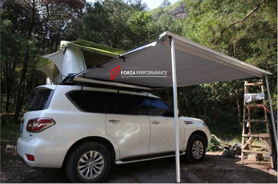 AWNING ON THE ROOF OF A CAR FOR OUTDOOR RECREATION