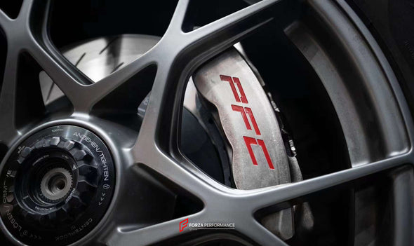 In the photos above you can see an installed Forza Performance Group set of large front brakes for the PORSCHE 911 992 GT3 with 380x34mm / 380x30mm brake discs by 20-inch brake rotors.  Current set includes:  4x Brake calipers 2x Front Brake discs&nbsp;380x34mm  2x Rear Brake discs 380x30mm 4x Brake caliper adapters 4x Brake Pads  4x Brake hoses and installation kits with nipples