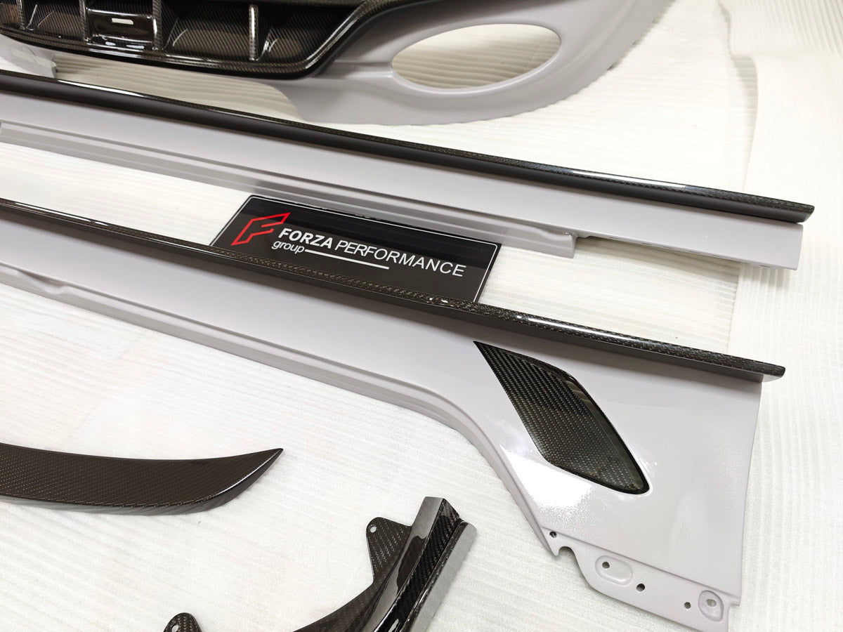 CARBON BODY KIT for BENTLEY FLYING SPUR 2020+

Set includes:
Hood Bonnet
Front Grille Frame
Front Lip
Side Skirts
Rear Diffuser
Side Mirror Covers
Material: Carbon Fiber

Note: Professional installation is required
