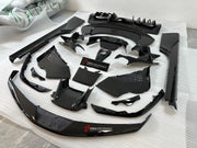CARBON OEM GENUINE PARTS for FERRARI SF90 2021+  Set includes:  Front Lip Front Trims Side Skirts Side Vents Rear Diffuser Rear Spoiler Wing Material: Carbon Fiber  NOTE: Professional installation is required.  Contact us for pricing