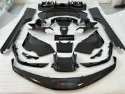 CARBON OEM GENUINE PARTS for FERRARI SF90 2021+  Set includes:  Front Lip Front Trims Side Skirts Side Vents Rear Diffuser Rear Spoiler Wing Material: Carbon Fiber  NOTE: Professional installation is required.  Contact us for pricing