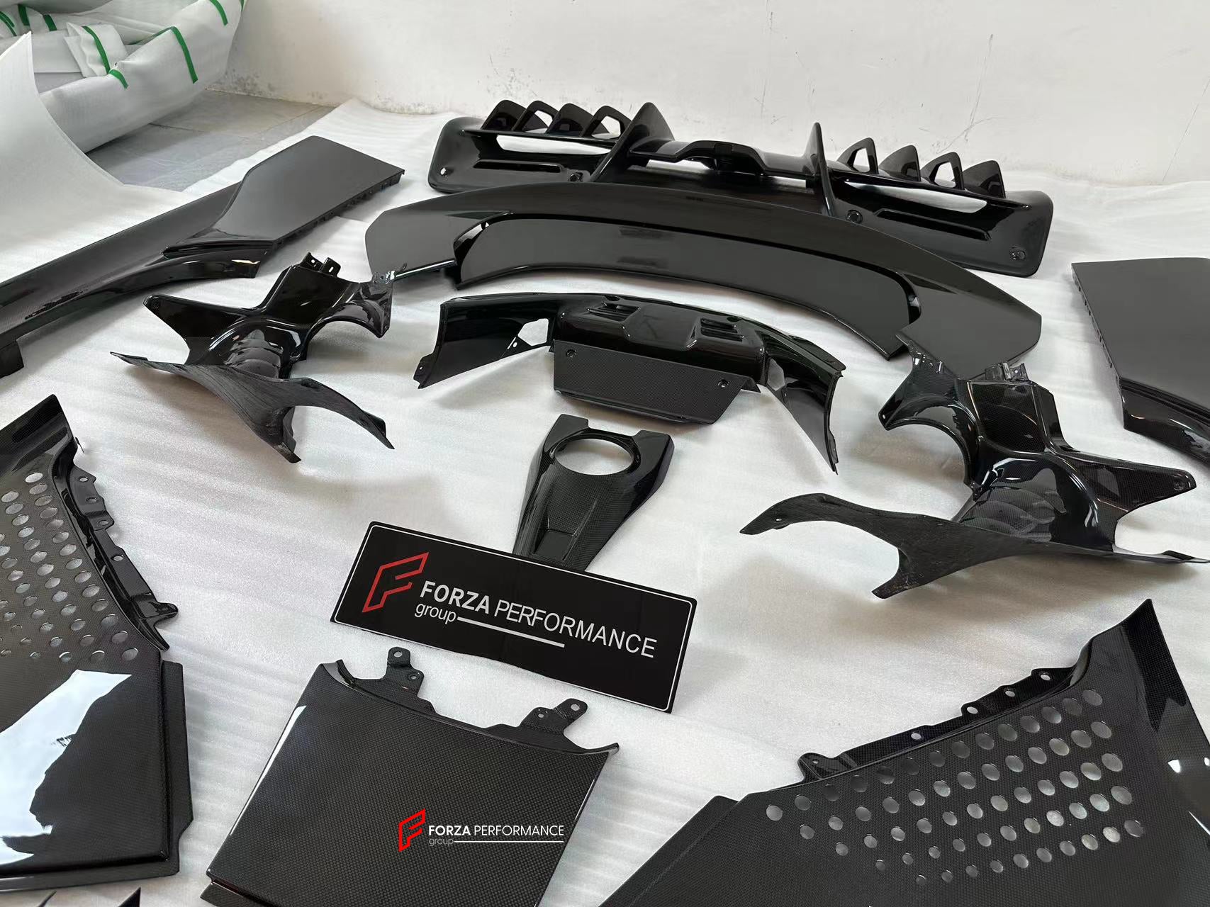 CARBON OEM GENUINE PARTS for FERRARI SF90 2021+  Set includes:  Front Lip Front Trims Side Skirts Side Vents Rear Diffuser Rear Spoiler Wing Material: Carbon Fiber  NOTE: Professional installation is required.  Contact us for pricing