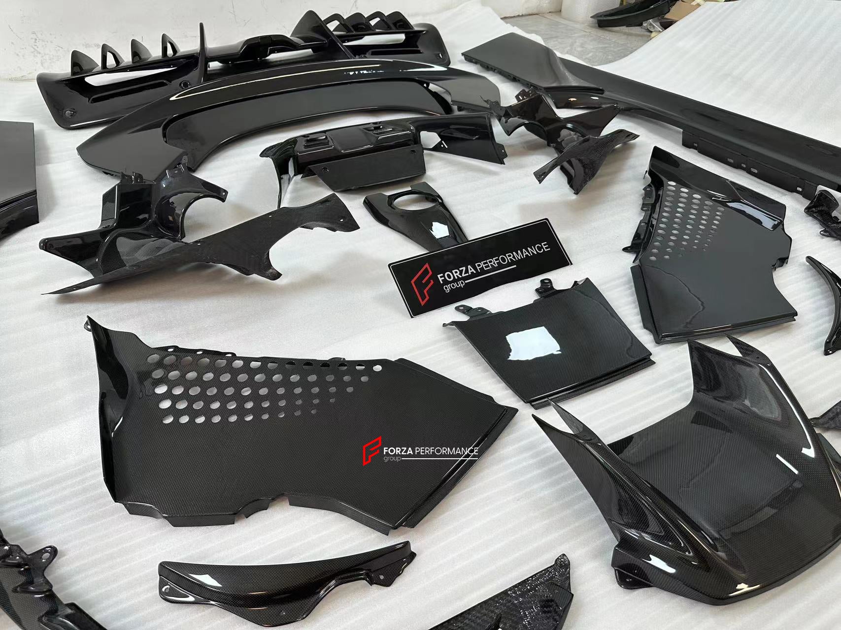 CARBON OEM GENUINE PARTS for FERRARI SF90 2021+  Set includes:  Front Lip Front Trims Side Skirts Side Vents Rear Diffuser Rear Spoiler Wing Material: Carbon Fiber  NOTE: Professional installation is required.  Contact us for pricing