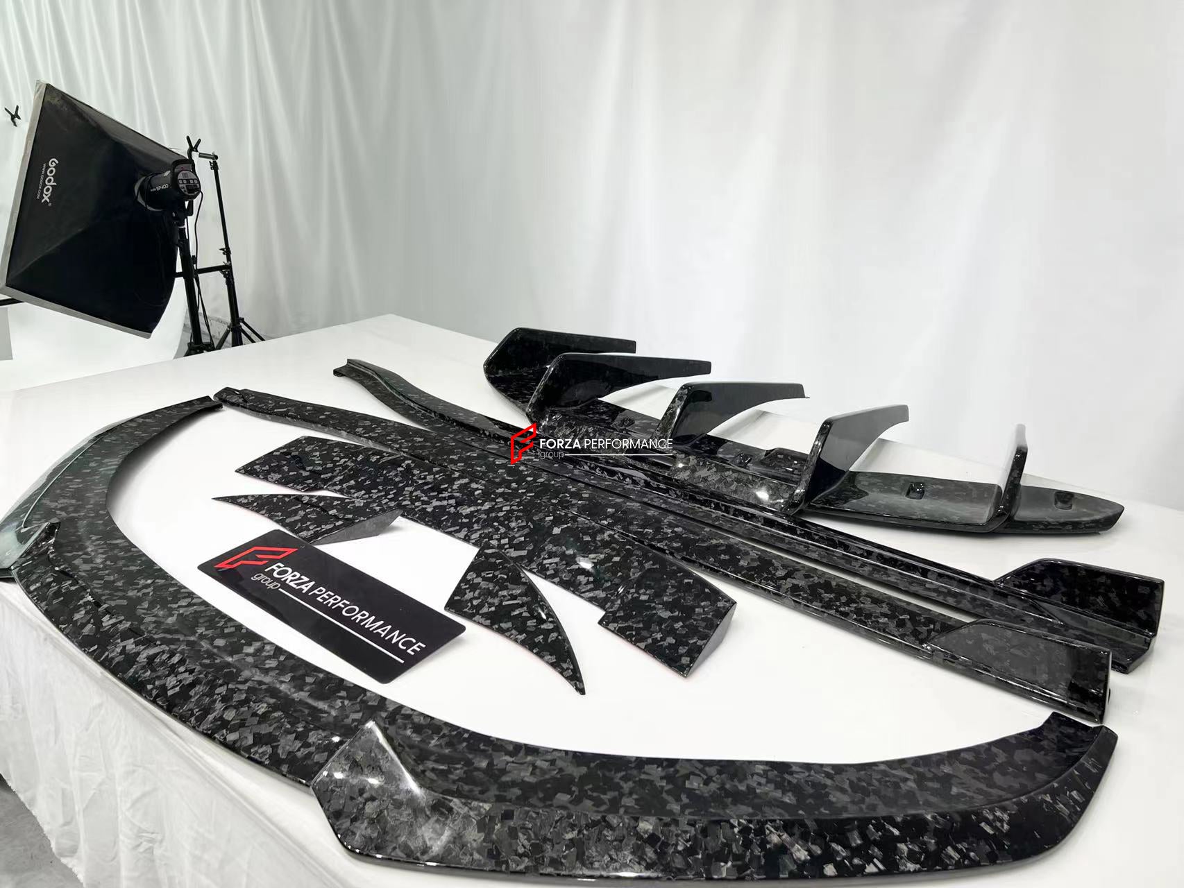 DRY CARBON BODY KIT for LOTUS EMIRA  Set includes:  Front Lip Side Skirts Rear Diffuser Rear Spoiler Front Air Vents Side Air Vents Rear Air Duct Side Mirrors