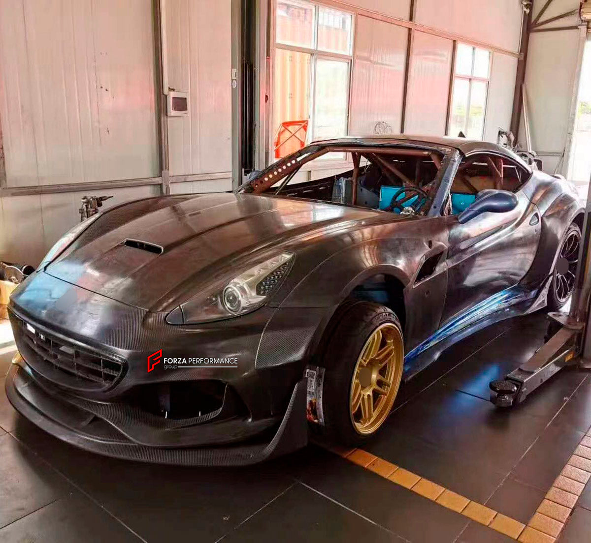 FRP Front Bumper With Dry Carbon Lip for Ferrari California 2009 - 2014

Set includes:
Front Bumper with Lip
Material: Fiber Glass and Dry Carbon

NOTE: Professional installation is required.