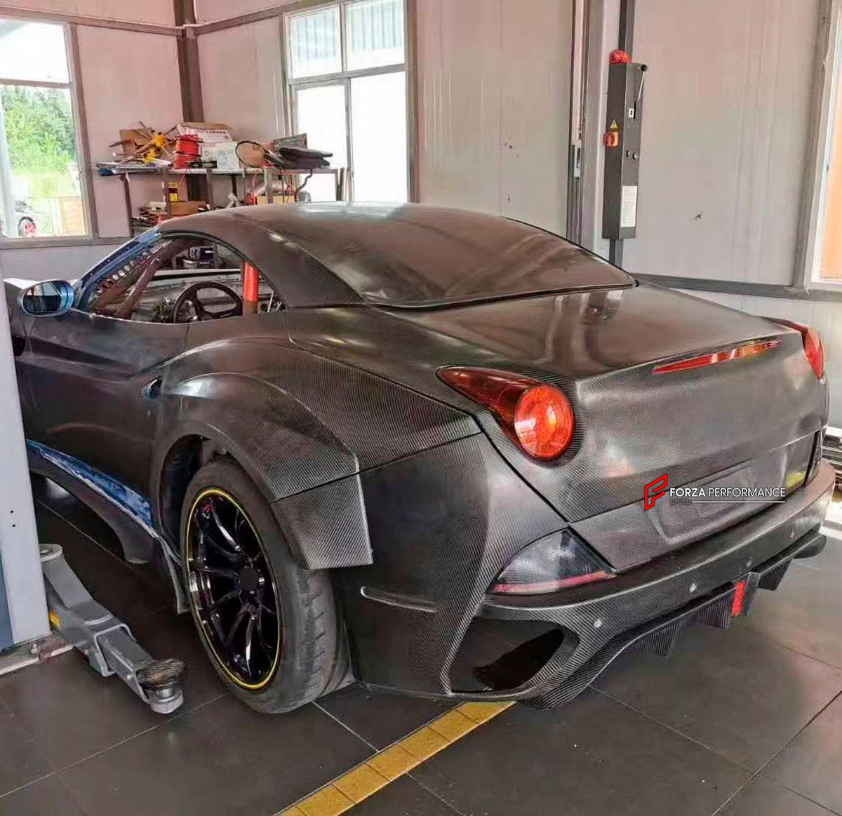 FRP Front Bumper With Dry Carbon Lip for Ferrari California 2009 - 2014

Set includes:
Front Bumper with Lip
Material: Fiber Glass and Dry Carbon

NOTE: Professional installation is required.