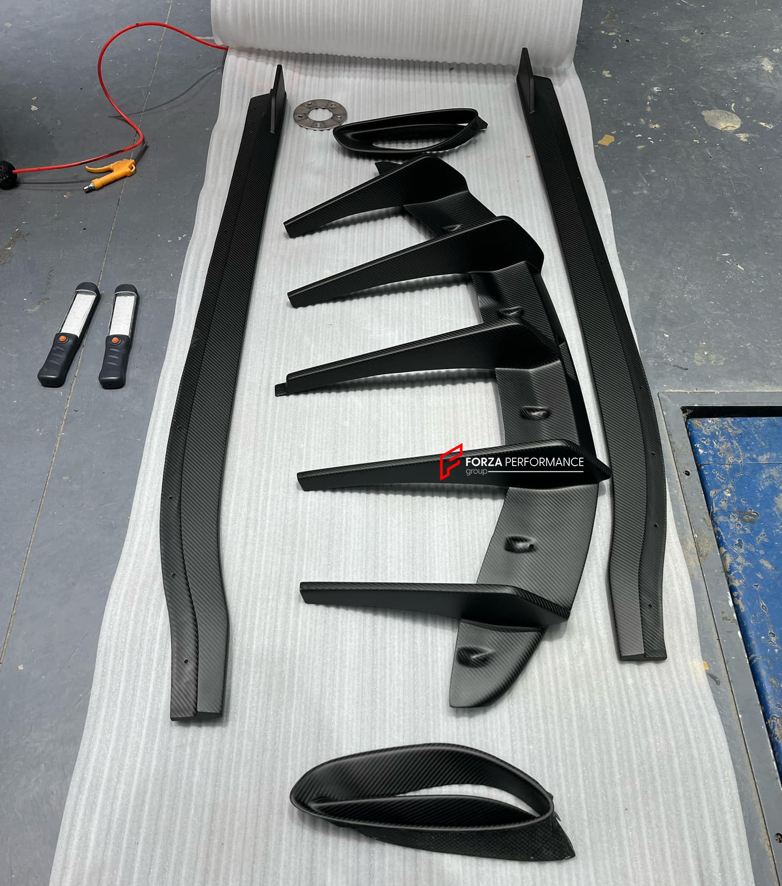 DRY CARBON BODY KIT for LOTUS EMIRA  Set includes:  Front Lip Side Skirts Rear Diffuser Rear Spoiler Front Air Vents Side Air Vents Rear Air Duct Side Mirrors