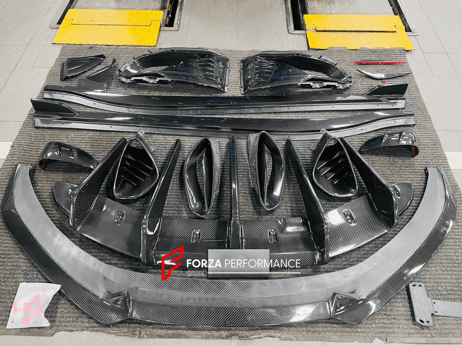 DRY CARBON BODY KIT for LOTUS EMIRA  Set includes:  Front Lip Side Skirts Rear Diffuser Rear Spoiler Front Air Vents Side Air Vents Rear Air Duct Side Mirrors