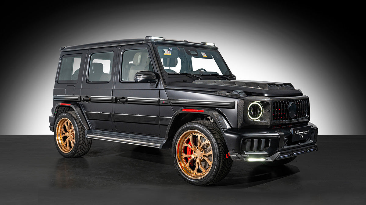 AUTHENTIC ROWEN CARBON BODY KIT for MERCEDES BENZ G CLASS AMG G63 W465 2024+

Set includes:

Front Lip

Front Bumper Air Vents Cover
Front Bumper Trims
Headlights Cover
Grille Cover
Turning Lights Cover
Hood Scoop
Roof Light
Roof Strip Trims
Door Window Frame
Side Mirrors Cover
Side Molding Trims
Door Panels
Fender Flares
Rear Spoiler
Rear Bumper Trims&nbsp;
Taillights Trims
Rear Diffuser

Material: Carbon Fiber