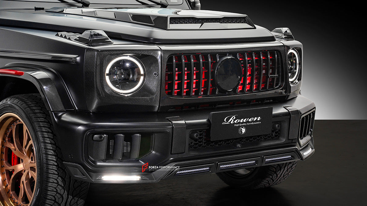 AUTHENTIC ROWEN CARBON BODY KIT for MERCEDES BENZ G CLASS AMG G63 W465 2024+

Set includes:

Front Lip

Front Bumper Air Vents Cover
Front Bumper Trims
Headlights Cover
Grille Cover
Turning Lights Cover
Hood Scoop
Roof Light
Roof Strip Trims
Door Window Frame
Side Mirrors Cover
Side Molding Trims
Door Panels
Fender Flares
Rear Spoiler
Rear Bumper Trims&nbsp;
Taillights Trims
Rear Diffuser

Material: Carbon Fiber