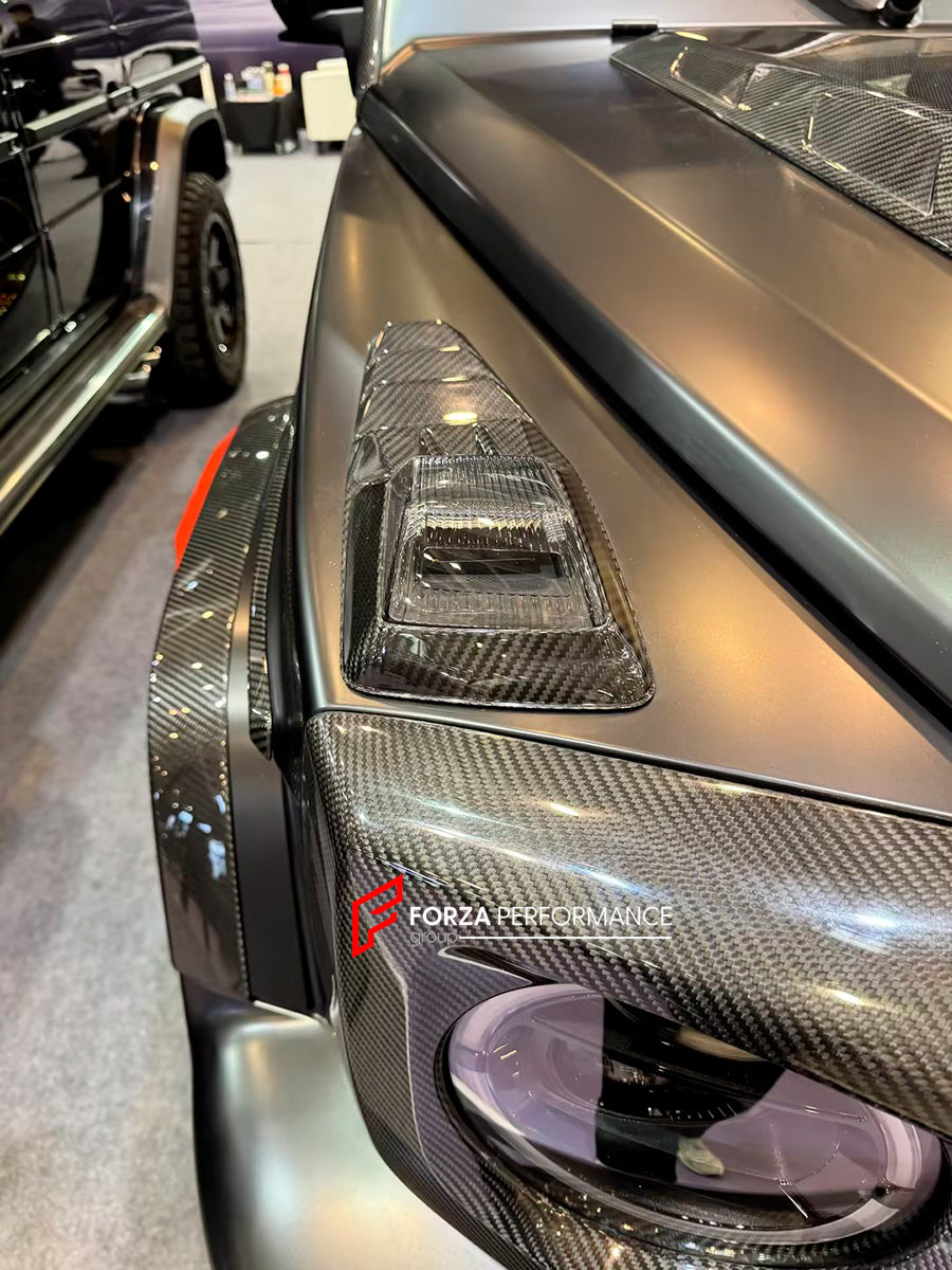 AUTHENTIC ROWEN CARBON BODY KIT for MERCEDES BENZ G CLASS AMG G63 W465 2024+

Set includes:

Front Lip

Front Bumper Air Vents Cover
Front Bumper Trims
Headlights Cover
Grille Cover
Turning Lights Cover
Hood Scoop
Roof Light
Roof Strip Trims
Door Window Frame
Side Mirrors Cover
Side Molding Trims
Door Panels
Fender Flares
Rear Spoiler
Rear Bumper Trims&nbsp;
Taillights Trims
Rear Diffuser

Material: Carbon Fiber