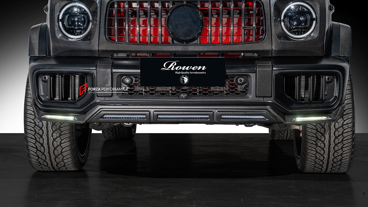 AUTHENTIC ROWEN CARBON BODY KIT for MERCEDES BENZ G CLASS AMG G63 W465 2024+

Set includes:

Front Lip

Front Bumper Air Vents Cover
Front Bumper Trims
Headlights Cover
Grille Cover
Turning Lights Cover
Hood Scoop
Roof Light
Roof Strip Trims
Door Window Frame
Side Mirrors Cover
Side Molding Trims
Door Panels
Fender Flares
Rear Spoiler
Rear Bumper Trims&nbsp;
Taillights Trims
Rear Diffuser

Material: Carbon Fiber