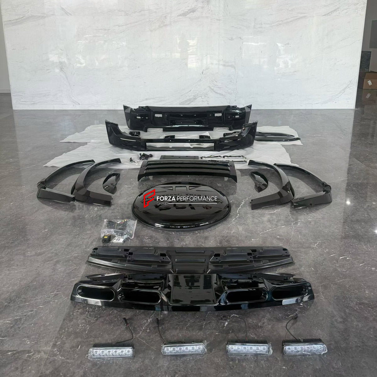 BODY KIT for LAND ROVER DEFENDER L663 110 2020+ FORZA PERFORMANCE custom fit LM

Set includes:
Front Bumper Assembly
Front Grille
Roof Light Bar
Fender Flares
Rear Bumper Assembly
Rear Diffuser
Spare Wheel Tire Cover
Exhaust Tips

Material: Plastic

NOTE: Professional installation is required.