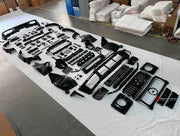 BODY KIT for Mercedes Benz G Class W465 G63 G500 2024+
Set includes:

Front Lip
Front Bumper Assembly
Front Grille
License Plate
Hood Bonnet
Front Fenders
Side Mirror Covers
Roof Light Bar
Rear Fenders
Roof Spoiler
Rear Diffuser
Rear Bumper Assembly
Material: Plastic

NOTE: Professional installation is required.