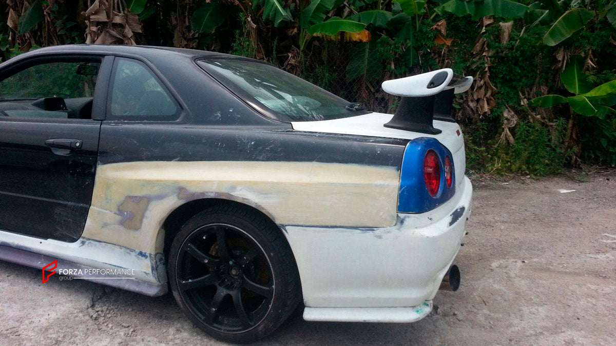 BODY KIT for Nissan R34
Set includes:

Front Hood Bonnet
Front Bumper
Front Spoiler Lip
Front Fender
Side Skirt
Side Under Spoiler
Rear Fender
Rear Bumper
Rear Under Apron
Rear Wing Spoiler
Rear Under Broad Diffuser
NOTE: Professional installation is required.