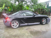 BODY KIT for Porsche Cayman 987 2009 - 2011
Set includes:

Front Bumper
Side Skirts
Rear Bumper
Rear Spoiler Wing
Material: Plastic

NOTE: Professional installation is required.

