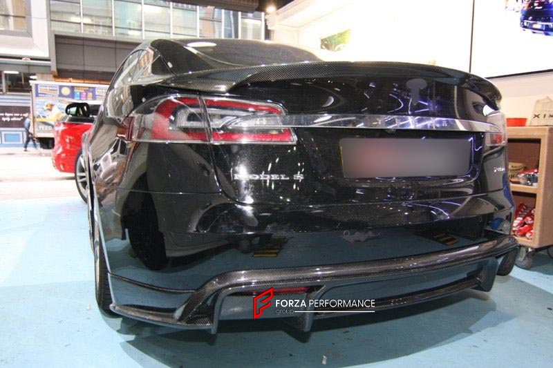 BODY KIT for TESLA MODEL S FR DESIGN CARBON FIBER

Set includes:
Front Spoiler Lip
Rear Spoiler Lip
Side Skirt
Tail Spoiler

Material: Carbon

NOTE: Professional installation is required.