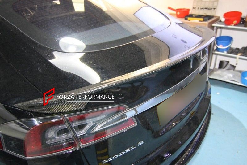 BODY KIT for TESLA MODEL S FR DESIGN CARBON FIBER

Set includes:
Front Spoiler Lip
Rear Spoiler Lip
Side Skirt
Tail Spoiler

Material: Carbon

NOTE: Professional installation is required.