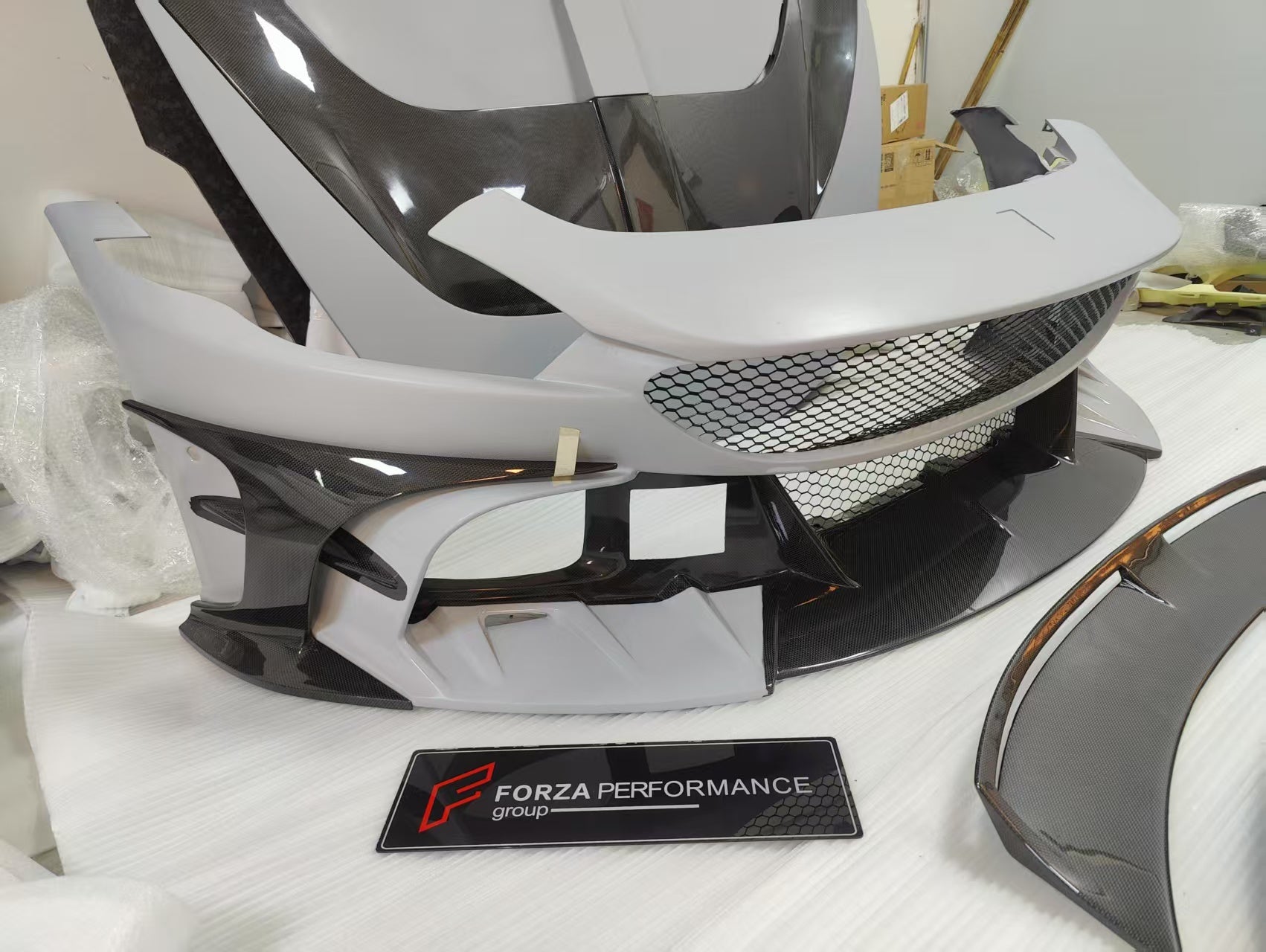 CARBON BODY KIT for FERRARI ROMA

Set includes:

Front Bumper
Front Grille
Hood / Bonnet
Side Mirror Covers
Side Trims
Side Skirts
Trunk Panel
Rear Spoiler

Rear Diffuser

Material: Carbon Fiber

Note: Professional installation is required.