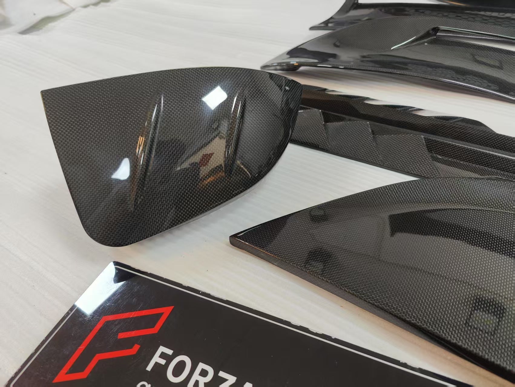 CARBON BODY KIT for FERRARI ROMA

Set includes:

Front Bumper
Front Grille
Hood / Bonnet
Side Mirror Covers
Side Trims
Side Skirts
Trunk Panel
Rear Spoiler

Rear Diffuser

Material: Carbon Fiber

Note: Professional installation is required.