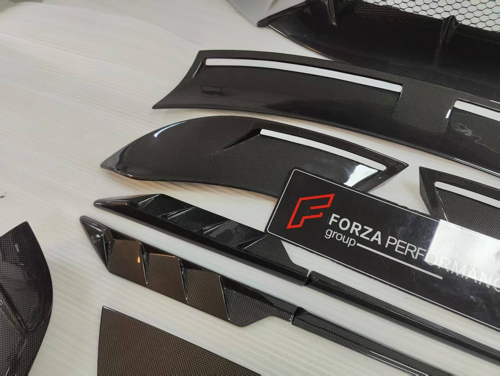CARBON BODY KIT for FERRARI ROMA

Set includes:

Front Bumper
Front Grille
Hood / Bonnet
Side Mirror Covers
Side Trims
Side Skirts
Trunk Panel
Rear Spoiler

Rear Diffuser

Material: Carbon Fiber

Note: Professional installation is required.