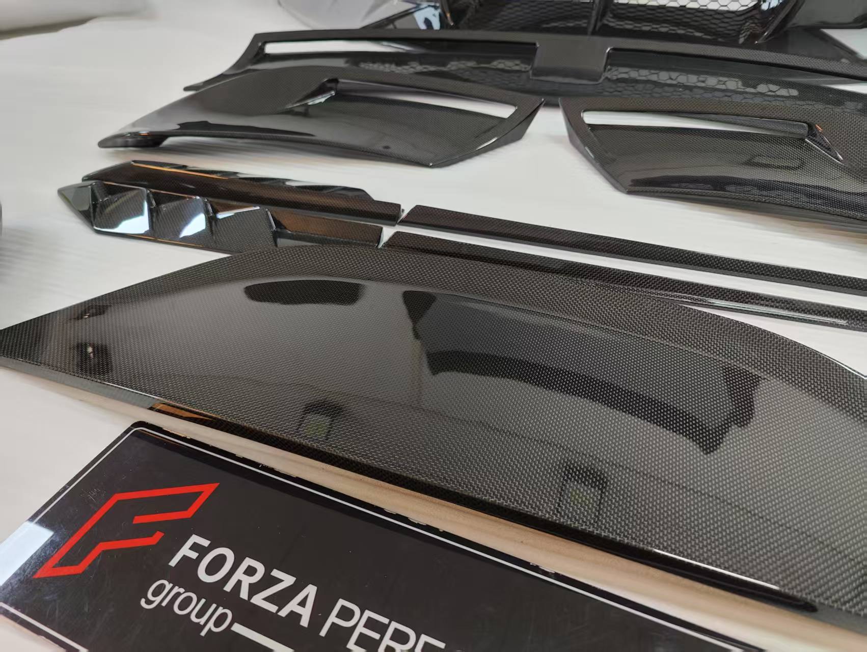 CARBON BODY KIT for FERRARI ROMA

Set includes:

Front Bumper
Front Grille
Hood / Bonnet
Side Mirror Covers
Side Trims
Side Skirts
Trunk Panel
Rear Spoiler

Rear Diffuser

Material: Carbon Fiber

Note: Professional installation is required.