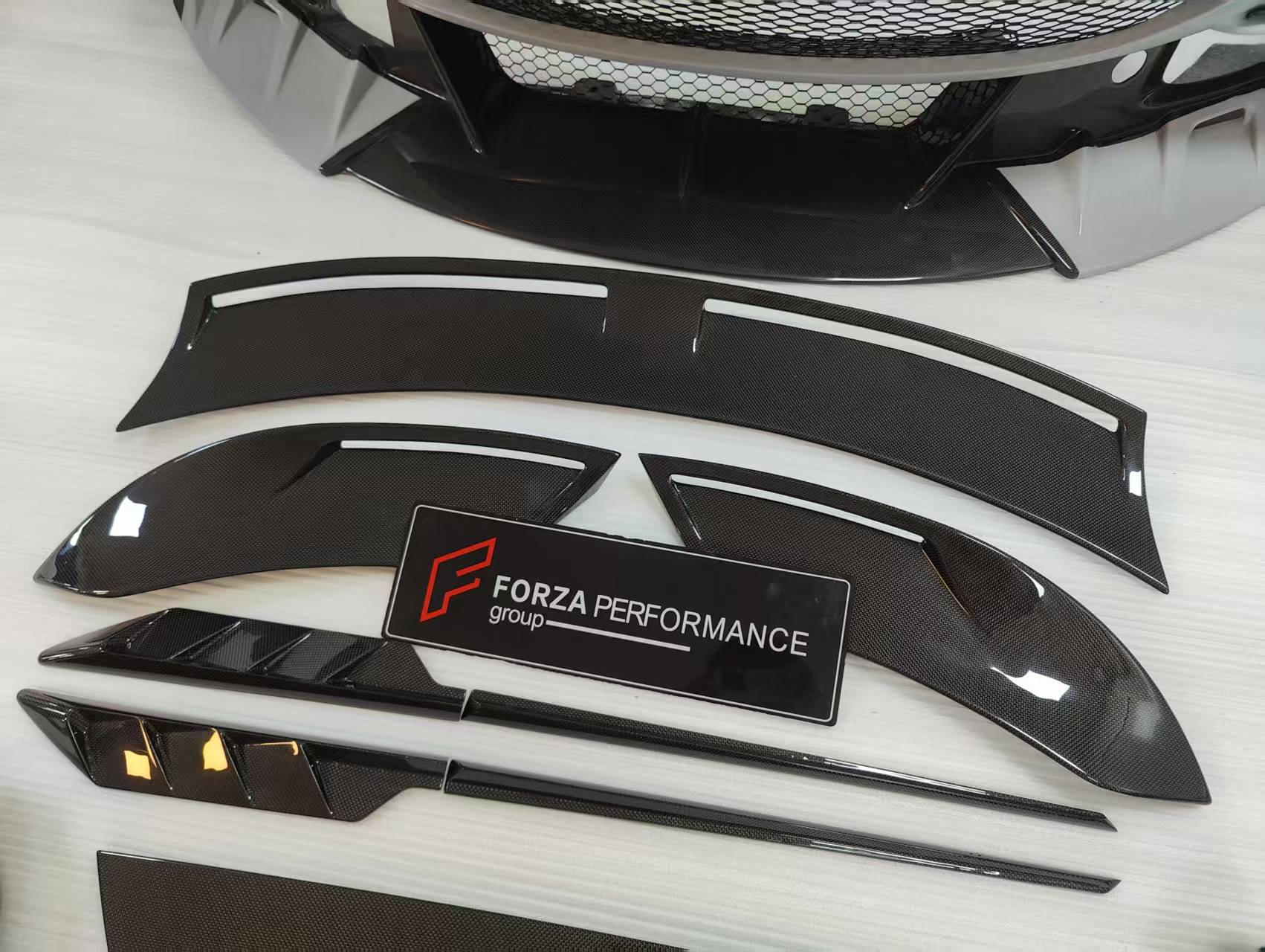 CARBON BODY KIT for FERRARI ROMA

Set includes:

Front Bumper
Front Grille
Hood / Bonnet
Side Mirror Covers
Side Trims
Side Skirts
Trunk Panel
Rear Spoiler

Rear Diffuser

Material: Carbon Fiber

Note: Professional installation is required.
