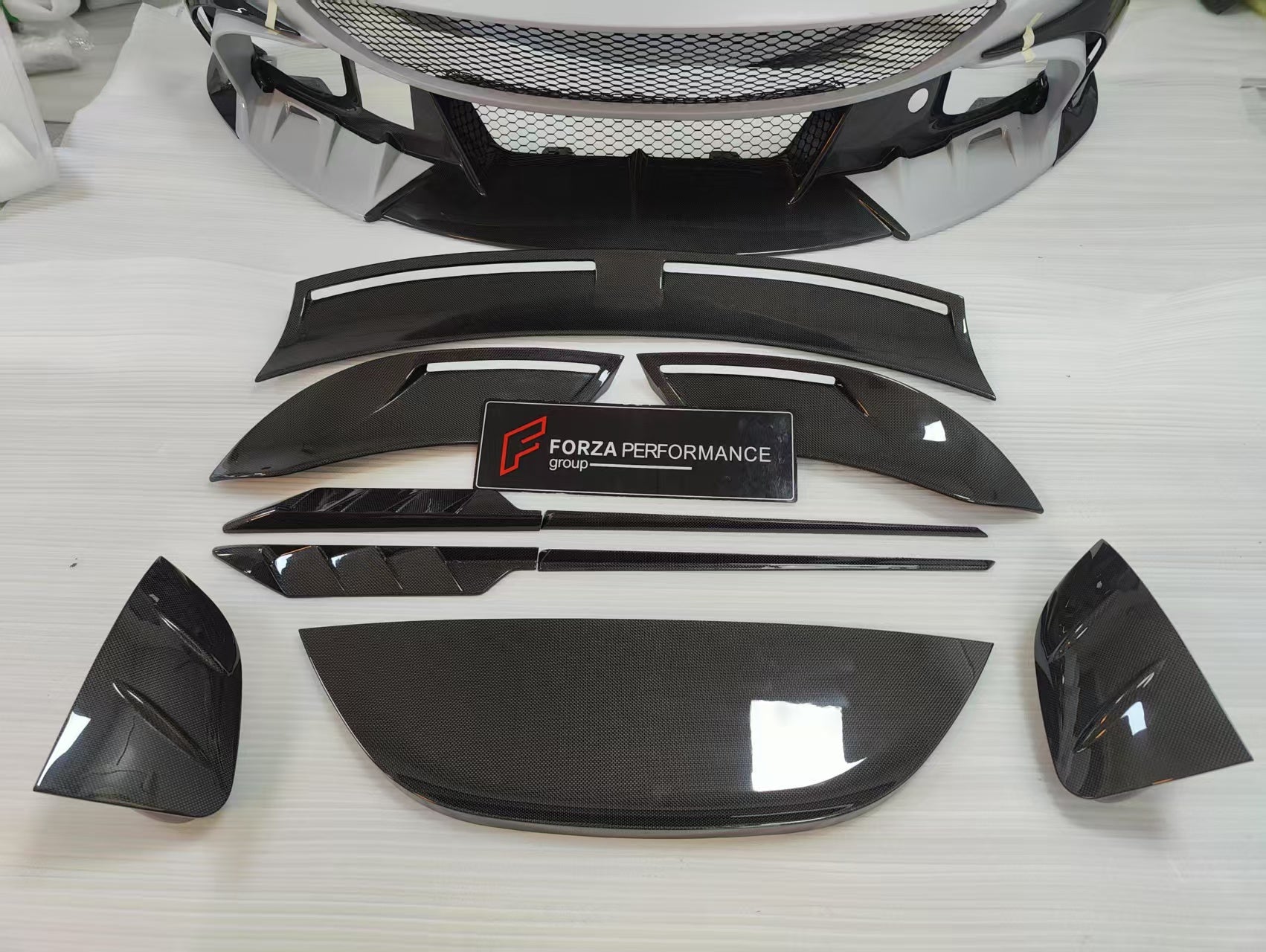 CARBON BODY KIT for FERRARI ROMA

Set includes:

Front Bumper
Front Grille
Hood / Bonnet
Side Mirror Covers
Side Trims
Side Skirts
Trunk Panel
Rear Spoiler

Rear Diffuser

Material: Carbon Fiber

Note: Professional installation is required.