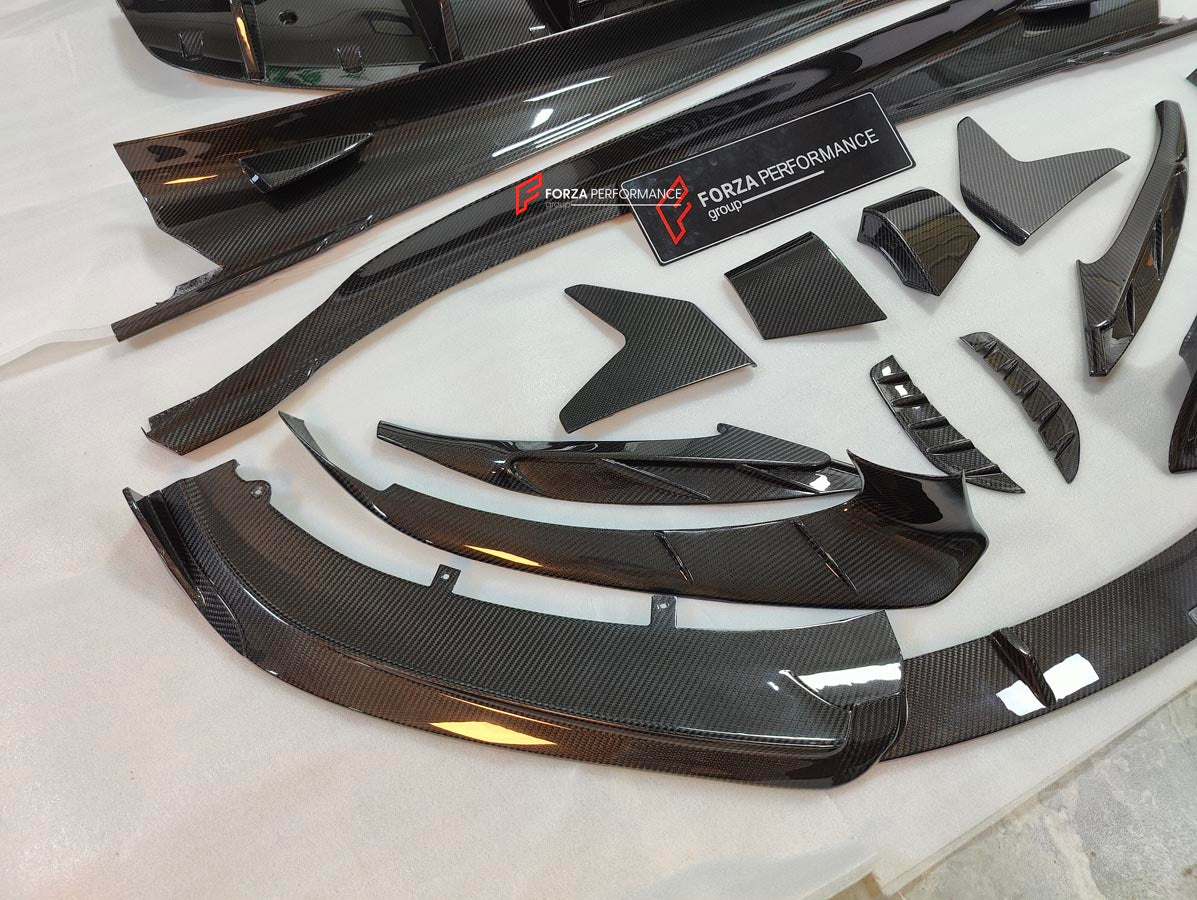 CARBON BODY KIT for LOTUS EMIRA

Set includes:

Roof
Hood
Front Lip
Front Bumper Air Vents
Front Canards
Rear Fender Air Vents
Side Skirts
Rear Diffuser
Rear Spoiler
Rear Spoiler Cover
Door Pedals
Engine Hood Cover
Rear Air Duct
Side Mirrors
Engine Grille

Material: Carbon