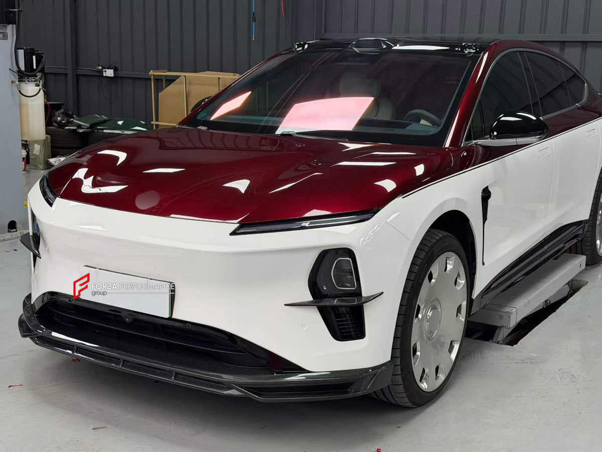 CARBON BODY KIT for NIO ET9 2025+

Set includes:
Front Lip
Front Bumper Canards
Side Skirts
Roof Spoiler
Ducktail Spoiler
Rear Diffuser

Material: Carbon

NOTE: Professional installation is required.