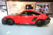 Carbon Body Kit for Porsche 911 997 Turbo
Set includes:

Front Bumper
Hood Bonnet
Side Skirts
Rear Fender Air Scoop
Rear Bumper
Rear Trunk
Rear Spoiler Wing
Material: Carbon

NOTE: Professional installation is required.