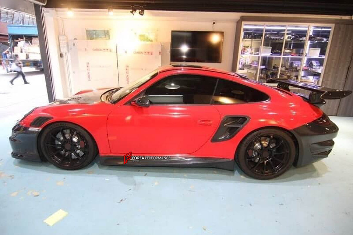 Carbon Body Kit for Porsche 911 997 Turbo
Set includes:

Front Bumper
Hood Bonnet
Side Skirts
Rear Fender Air Scoop
Rear Bumper
Rear Trunk
Rear Spoiler Wing
Material: Carbon

NOTE: Professional installation is required.