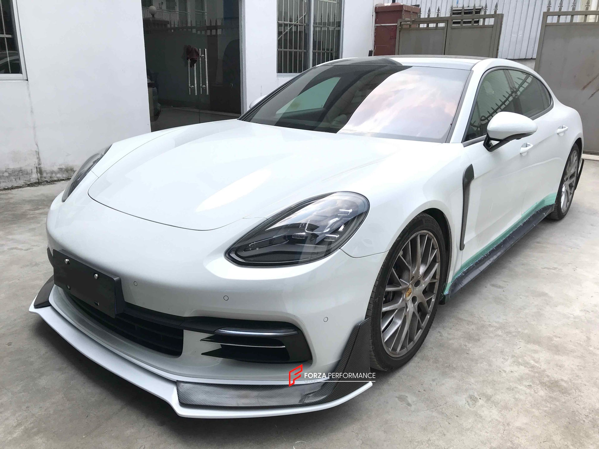 CARBON BODY KIT FOR PORSCHE PANAMERA 971 2017 - 2023

Set includes:

Front Lip
Side skirts
Side Vent
Rear Diffuser
Rear Spoiler

Material: Carbon + Plastic

NOTE: Professional installation is required. Factory LED DRL must be reused