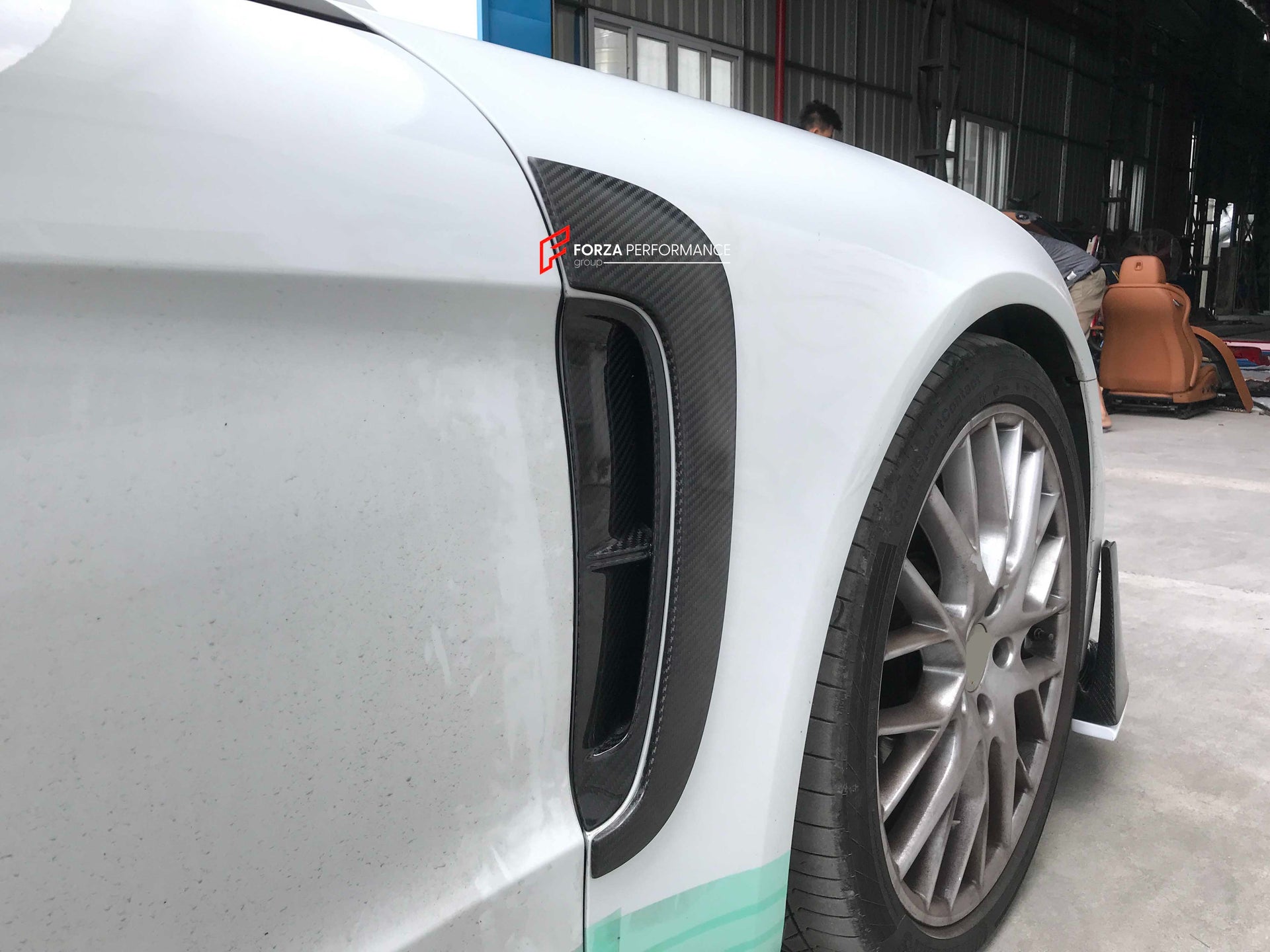 CARBON BODY KIT FOR PORSCHE PANAMERA 971 2017 - 2023

Set includes:

Front Lip
Side skirts
Side Vent
Rear Diffuser
Rear Spoiler

Material: Carbon + Plastic

NOTE: Professional installation is required. Factory LED DRL must be reused