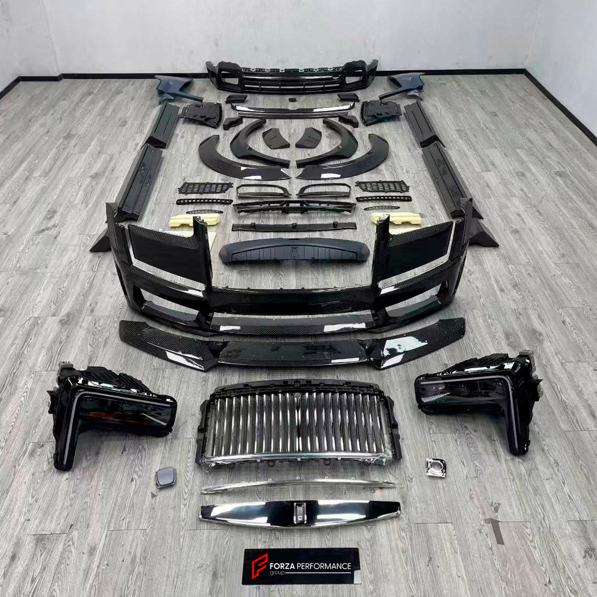 CARBON BODY KIT for ROLLS ROYCE CULLINAN 2024+ FORZA PERFORMANCE custom fit 1016
Set includes:

Front Lip
Front Bumper Assembly
Front Fenders Flares
Side Skirts
Body Side Door Moldings
Rear Fenders Flares
Roof Spoiler
Ducktail Spoiler
Rear Diffuser
Material: Carbon

NOTE: Professional installation is required.