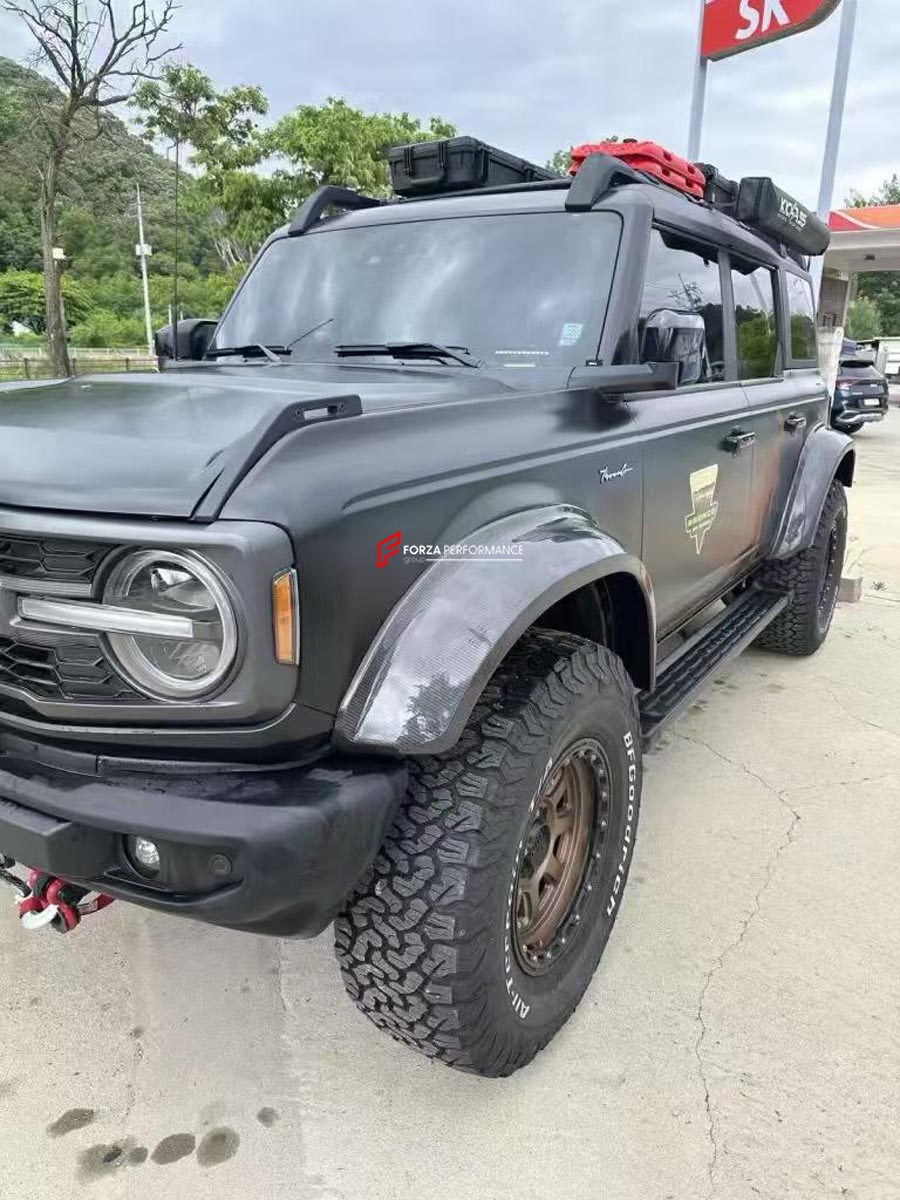 CARBON FENDER ARCHES for FORD BRONCO VI U725 4 DOOR 2021+ Forza Performance Custom fit
Set includes:

Front Fender Arches
Rear Fender Arches
Rear Fender Arch Extension Trims
Material: Carbon (Can be made in Diagonal Twill or Forged Pattern)

NOTE: Professional installation is required.