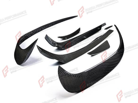 CARBON FRONT CANARDS 7 PCS for AUDI R8 4S 2016 - 2023
Set includes:

Front Canards (7 pcs/set)
Material: Carbon

NOTE: Add-on type - installs over the original part. Professional installation is required.