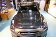 CARBON HOOD BONNET for NISSAN GT-R R35 TM010B

Set includes:
Hood Bonnet

Material: Carbon

NOTE: Professional installation is required.