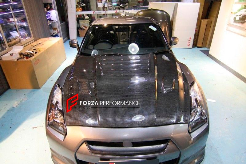CARBON HOOD BONNET for NISSAN GT-R R35 TM010B

Set includes:
Hood Bonnet

Material: Carbon

NOTE: Professional installation is required.